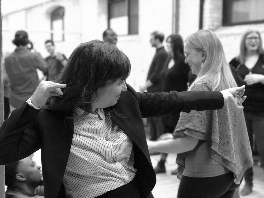 Participants moving together during a creative session