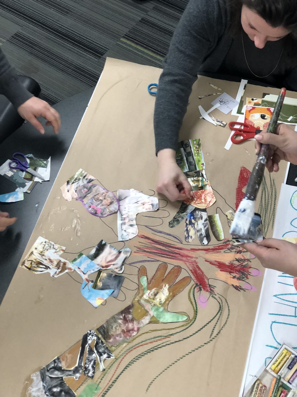 A team mapping ideas in collage and drawing