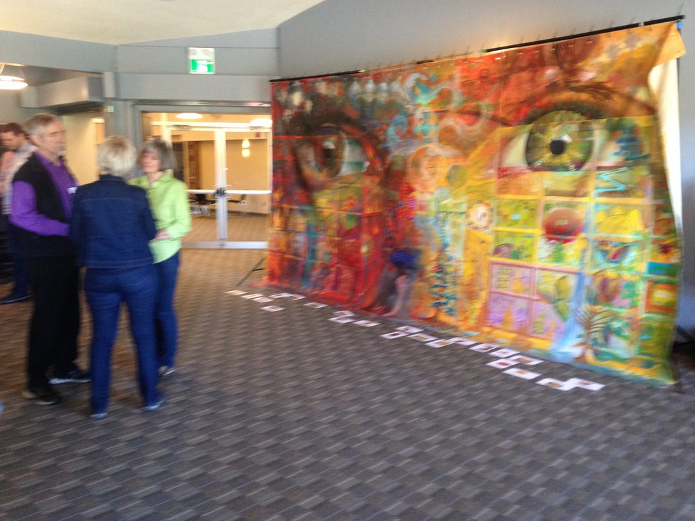 People reviewing the finished painting