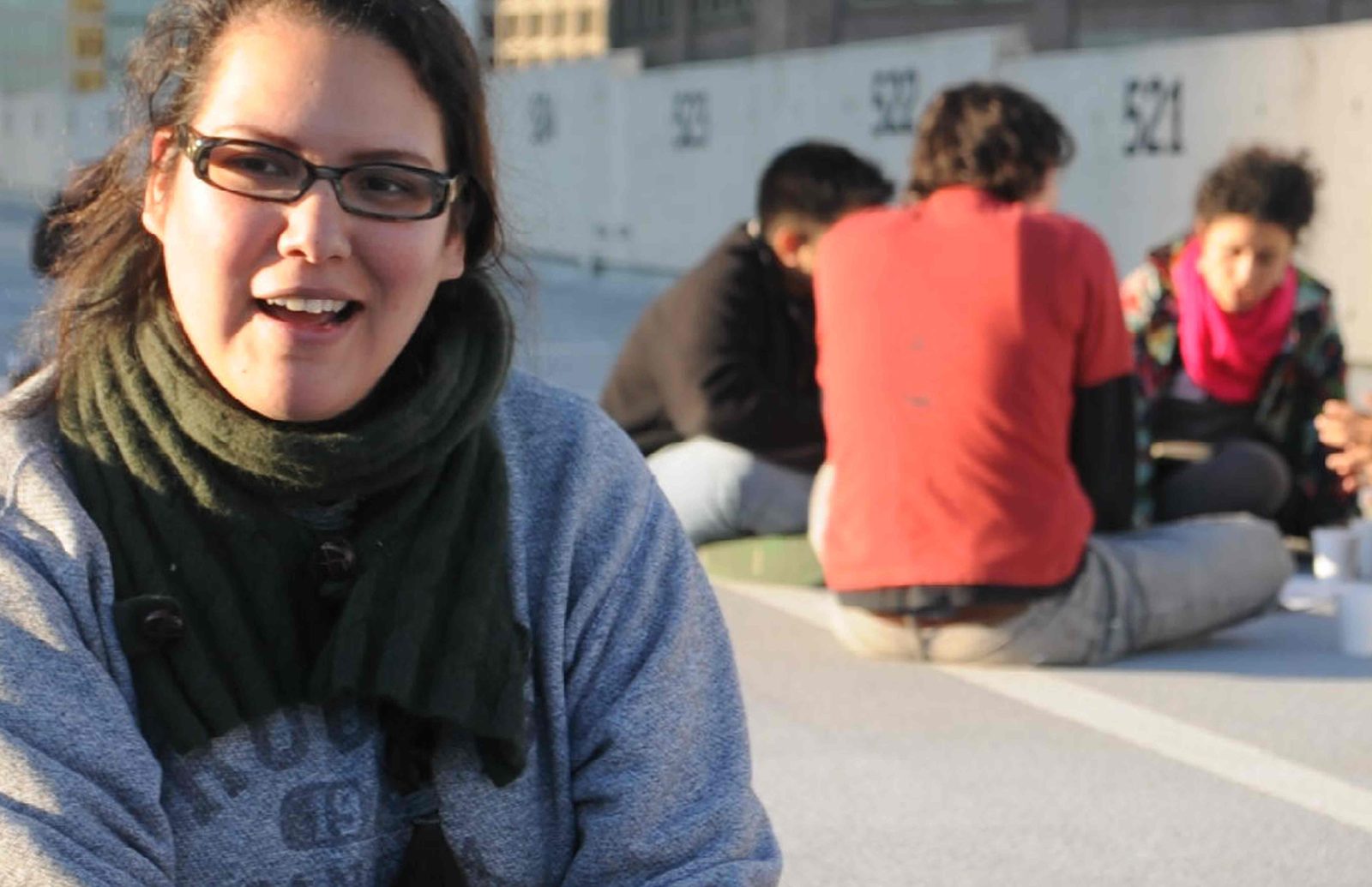 A participant smiling while she creates
